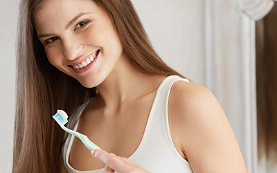 A woman brushing her teeth