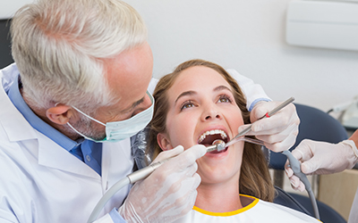 Dentist working on a patients teeth