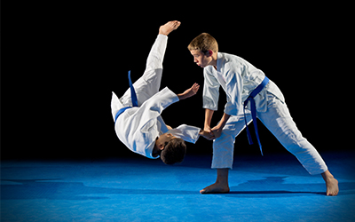 Two young boys doing karate