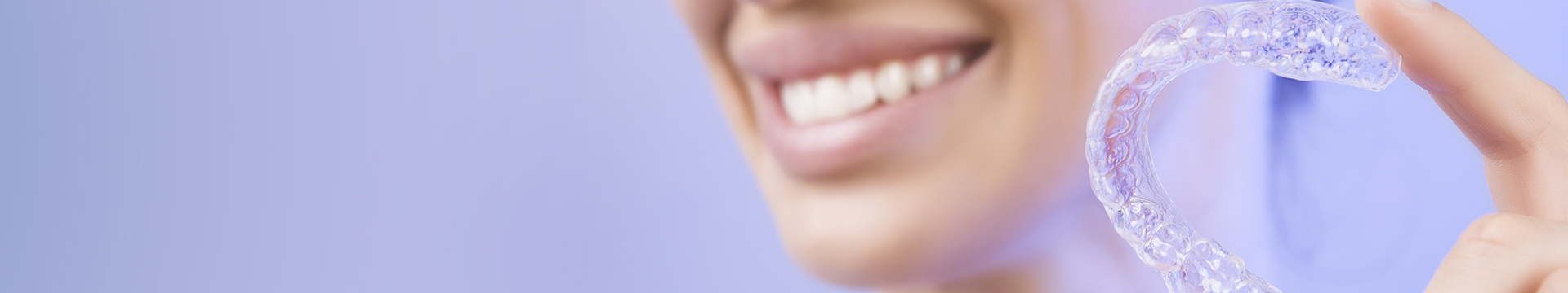 Cropped image of woman holding a dental night guard