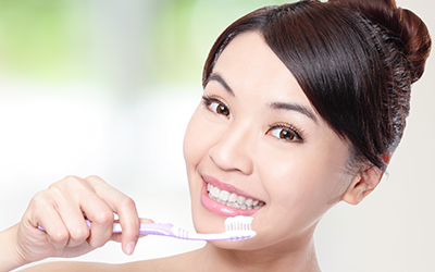 Woman brushing her teeth