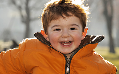 A young boy smiling