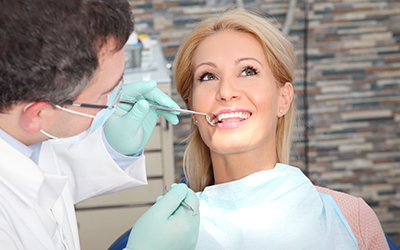 A woman having the dentist work on her teeth